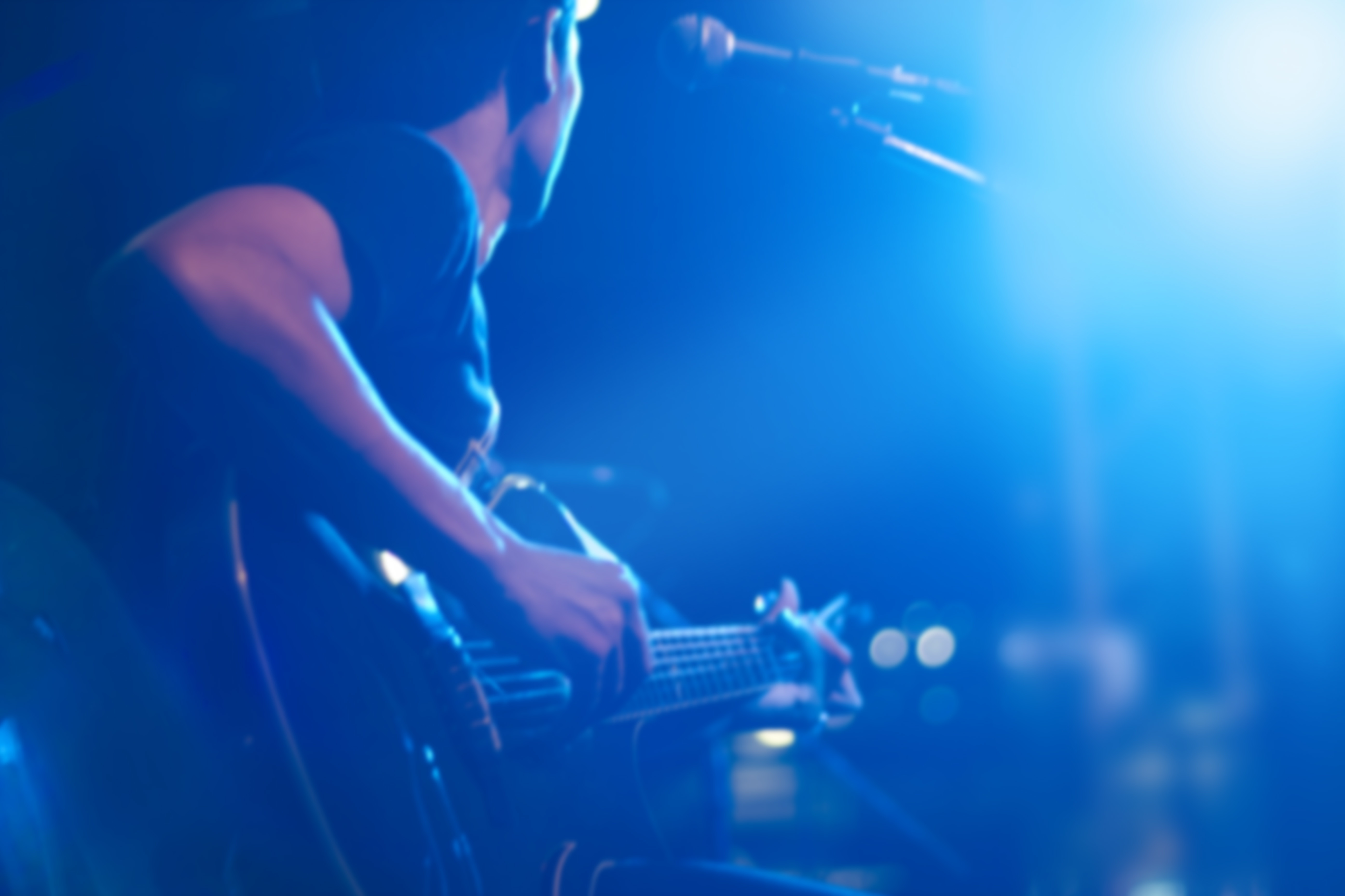 Guitarist on stage for background, soft and blur concept